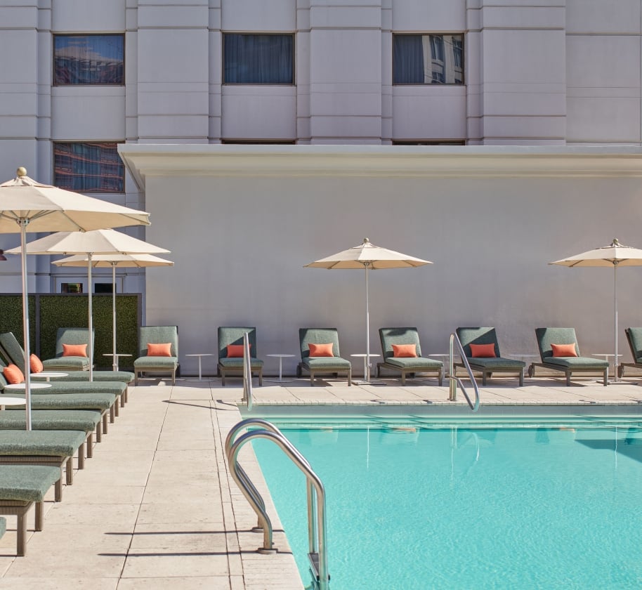 Lounge chairs surrounding the pool at the Camby