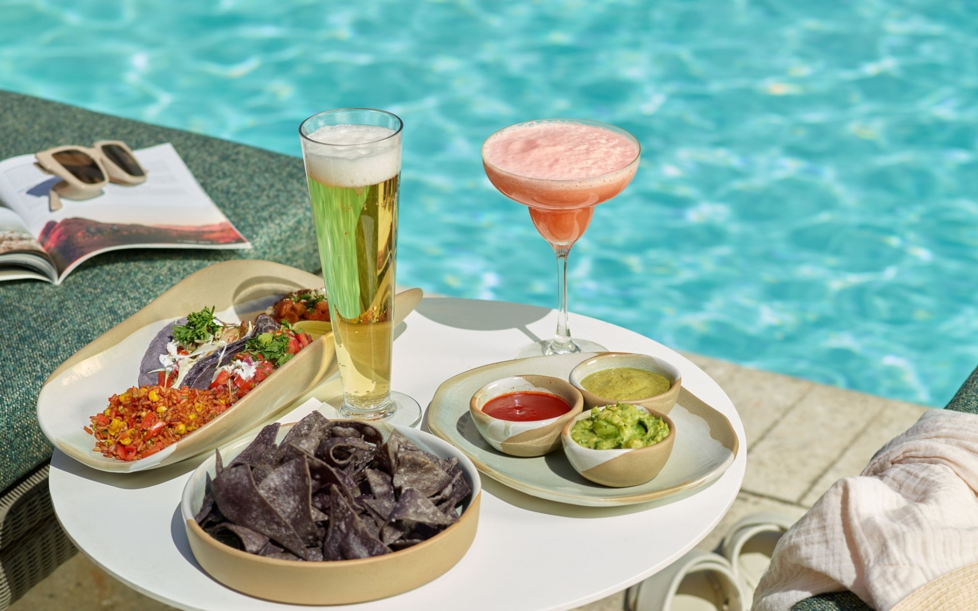 An assortment of snacks and drinks at Wade poolside bar