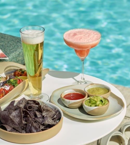 An assortment of snacks and drinks at Wade poolside bar