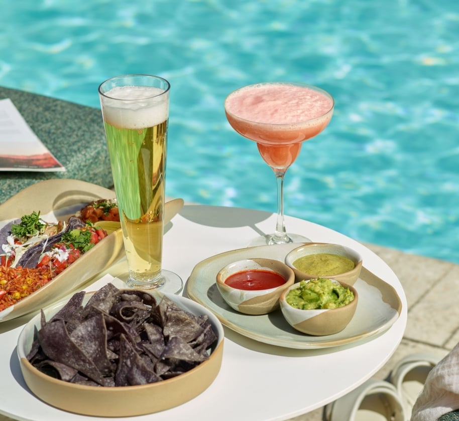 An assortment of snacks and drinks at Wade poolside bar