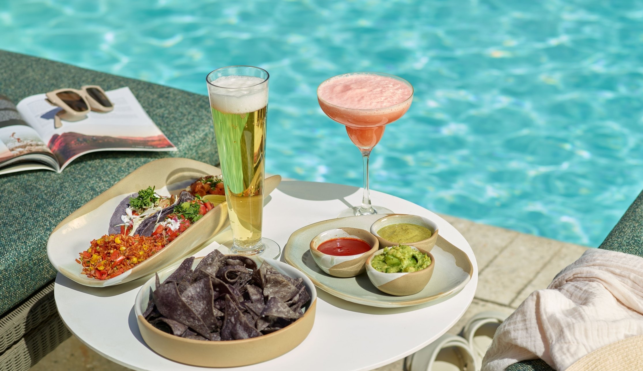 An assortment of snacks and drinks at Wade poolside bar