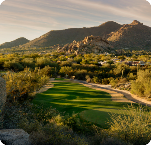 A golf fairway with mountains in the distance in Phoenix