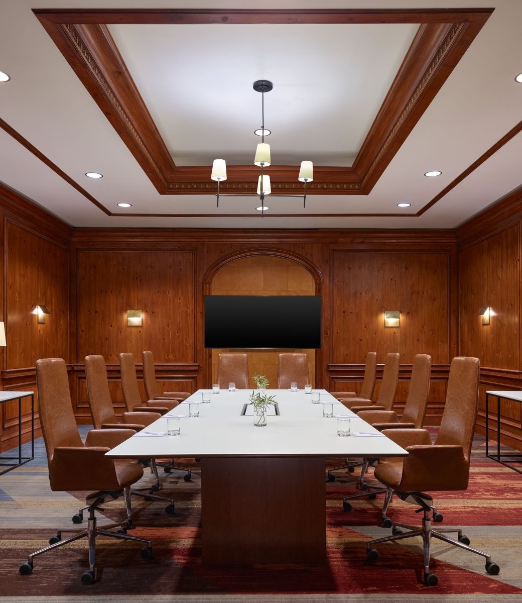 A large boardroom at the Camby with one large table setup for a meeting