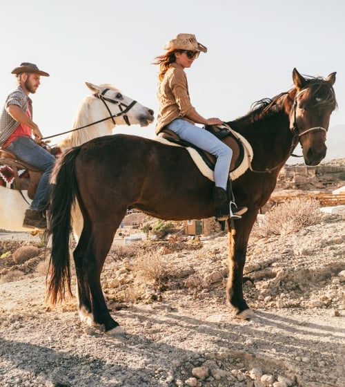 People riding horses in the outback of Arizona