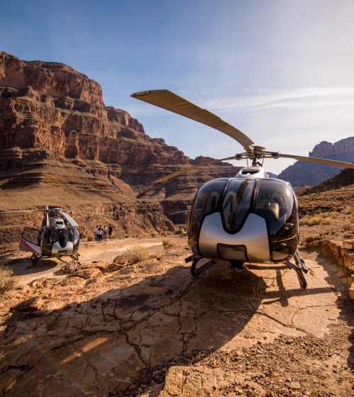 2 helicopters on the ground for Maverick Helicopter Tours in Arizona