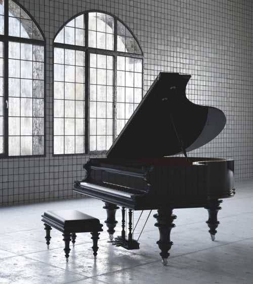 A piano in a beautiful tiled room at the Musical Instrument Museum