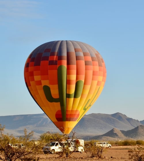 An air ballon in the desert for Rainbow Ryders Hot Air Ballon Ride in Arizona.