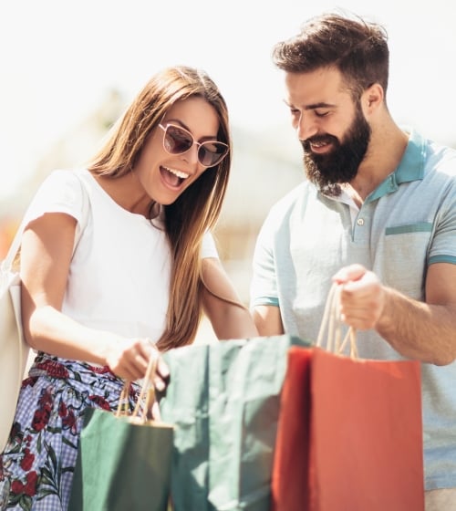 A couple showing each other what they bought from Scottsdale Fashion Square in Phoenix