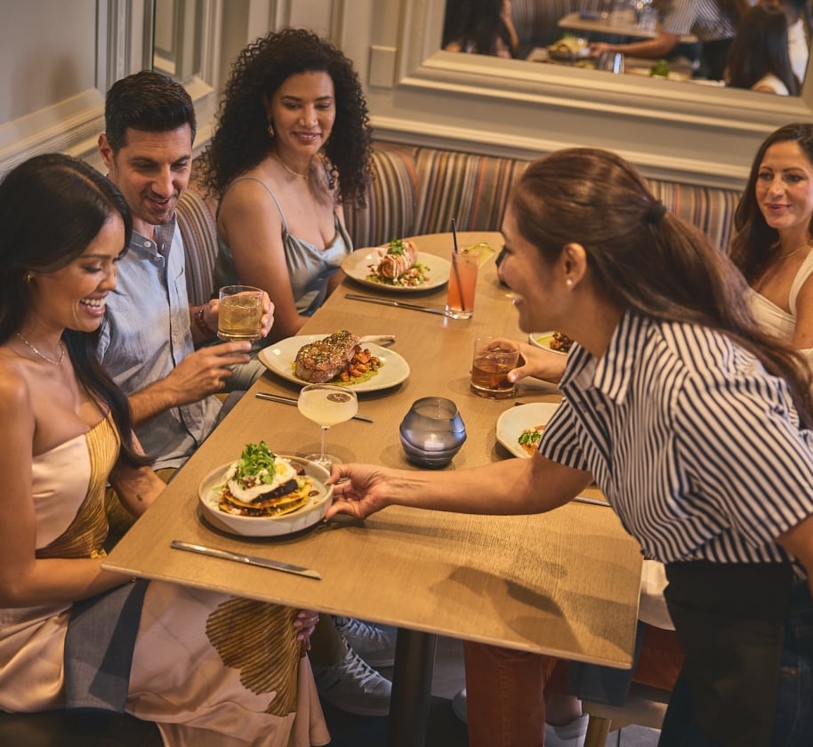 A group of people dining at Yellowbell in The Camby