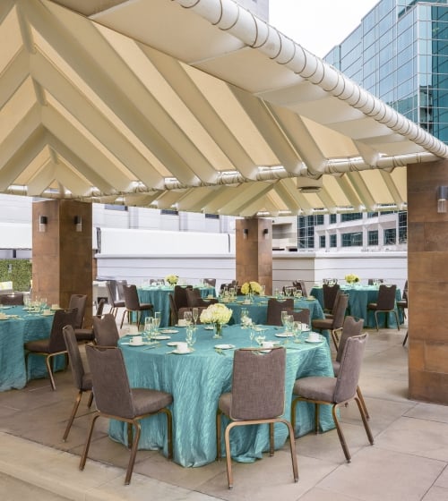 Tables setup at the Pool deck venue at the Camby