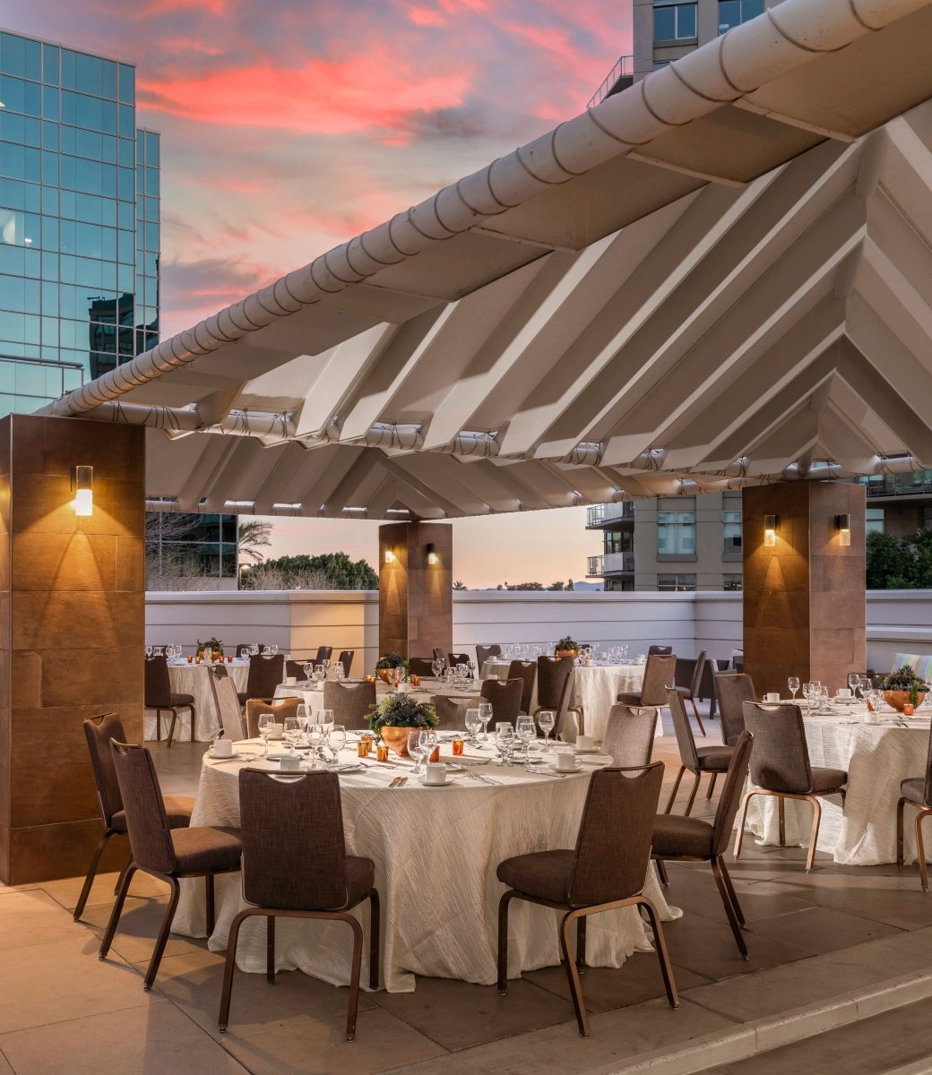 The pool deck venue setup for a gathering at sunset at the Camby