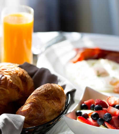 A spread of breakfast food in a room at the Camby