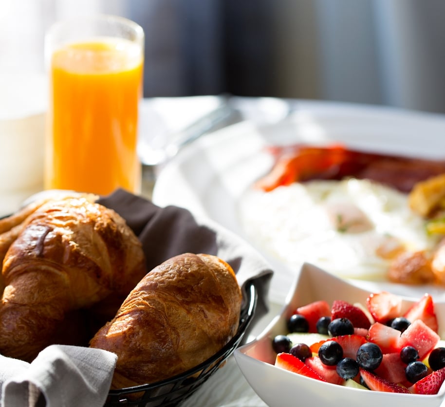 A spread of breakfast food in a room at the Camby