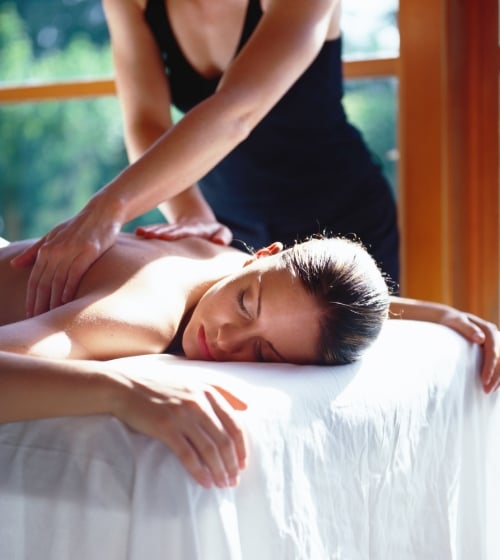 A woman getting a back massage at Tierra Luna Spa